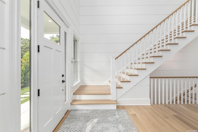 66 Peters Ln, Westhampton Beach, NY 11978 - entrance foyer featuring wood finished floors and stairs