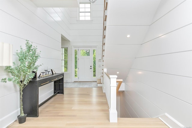 entryway with plenty of natural light and light hardwood / wood-style floors