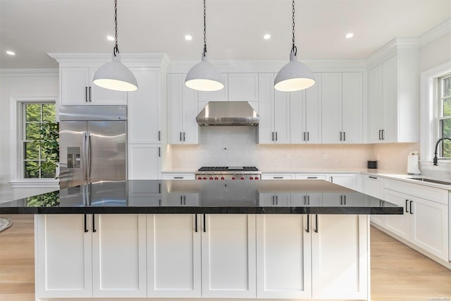 66 Peters Ln, Westhampton Beach, NY 11978 - kitchen with stainless steel built in fridge, wall chimney exhaust hood, backsplash, a center island, and white cabinetry