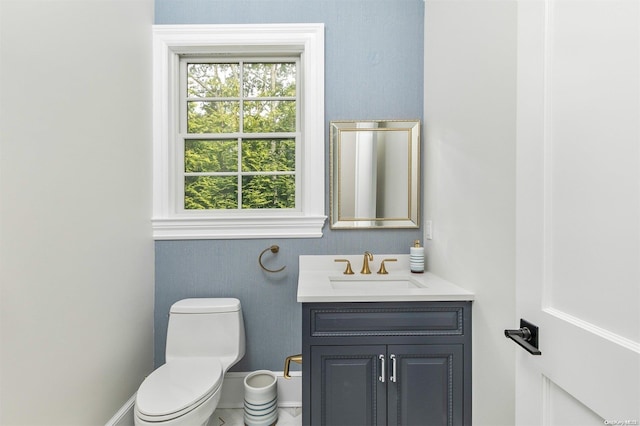 bathroom with vanity and toilet