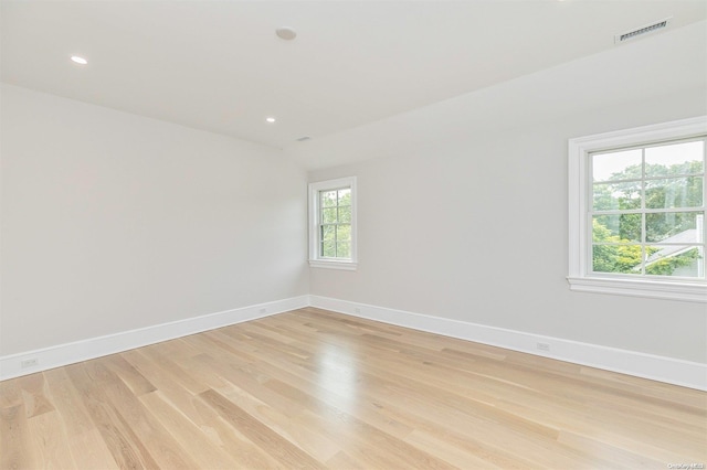 spare room featuring light hardwood / wood-style flooring