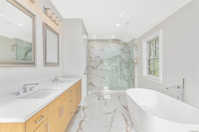 66 Peters Ln, Westhampton Beach, NY 11978 - bathroom with marble tiled floors, a freestanding bath, a marble finish shower, recessed lighting, and double vanity