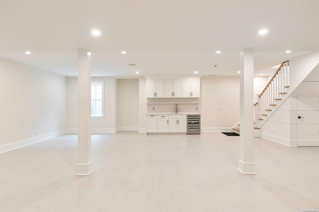 basement featuring sink and beverage cooler