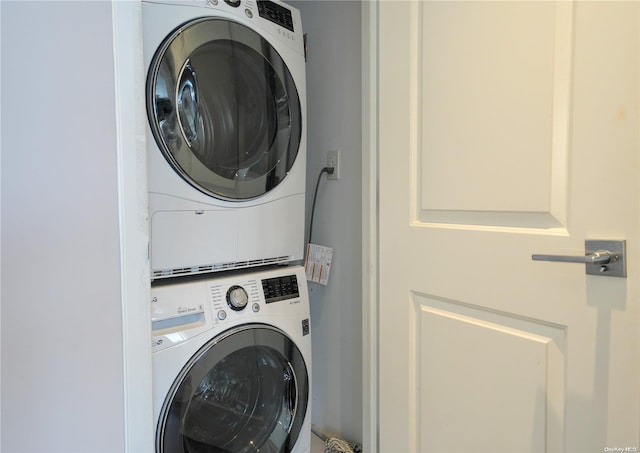 laundry room with stacked washer and clothes dryer