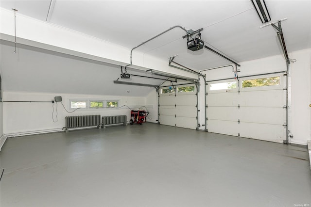 garage featuring radiator and a garage door opener