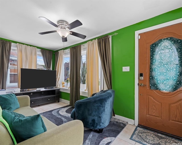 interior space with ceiling fan and light tile patterned floors