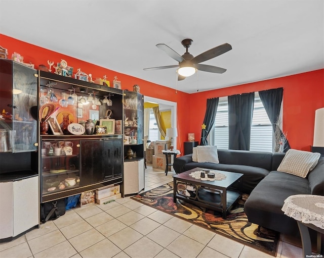 tiled living room featuring ceiling fan and a healthy amount of sunlight