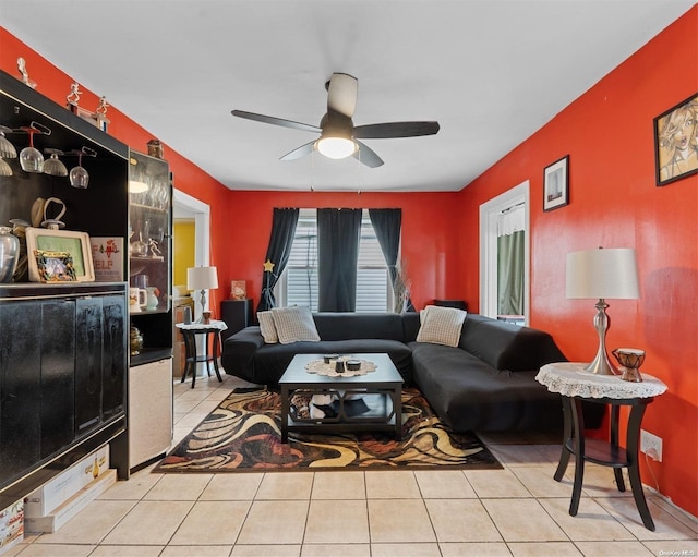 living room with ceiling fan and light tile patterned floors