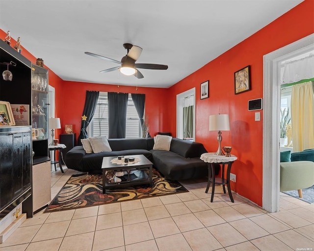 tiled living room featuring ceiling fan