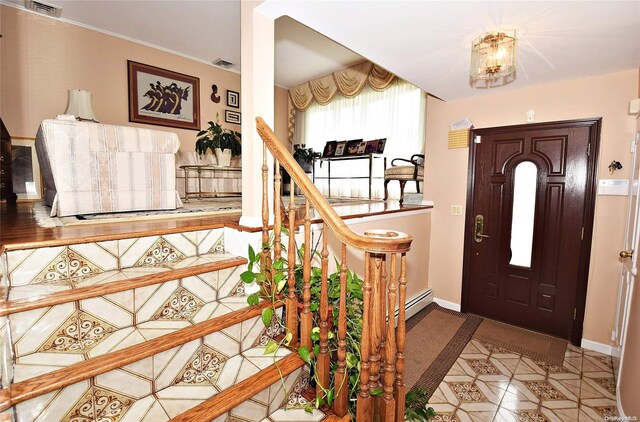 entrance foyer featuring a baseboard heating unit