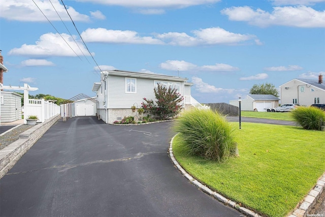 exterior space with a lawn and an outdoor structure