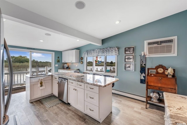 kitchen with stainless steel appliances, baseboard heating, vaulted ceiling with beams, light hardwood / wood-style flooring, and white cabinets