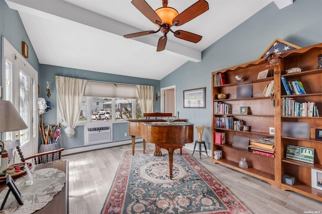 miscellaneous room featuring ceiling fan, vaulted ceiling with beams, light hardwood / wood-style floors, and a wealth of natural light