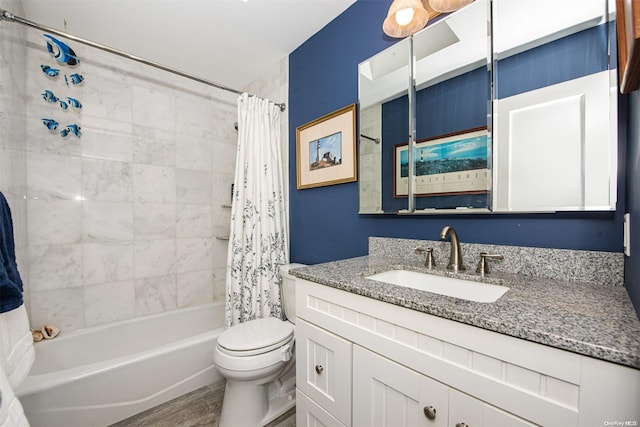 full bathroom featuring toilet, shower / bath combo with shower curtain, vanity, and hardwood / wood-style flooring