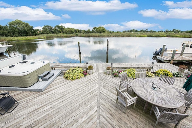 view of dock with a water view and central AC unit