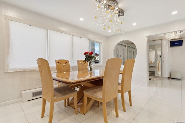 dining room with an inviting chandelier and light tile patterned flooring