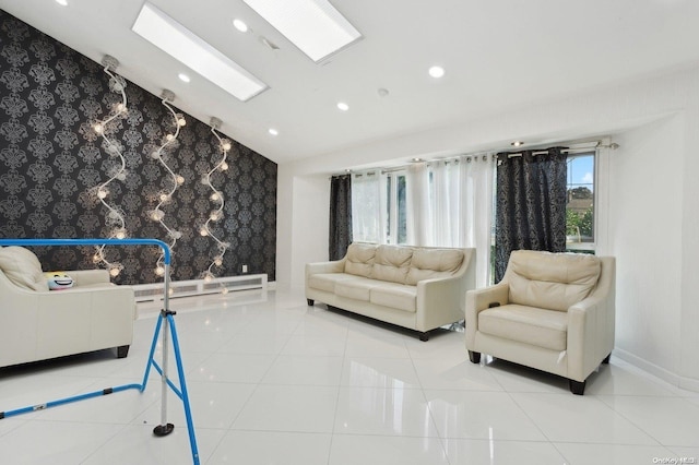 living room featuring light tile patterned floors, baseboard heating, and lofted ceiling