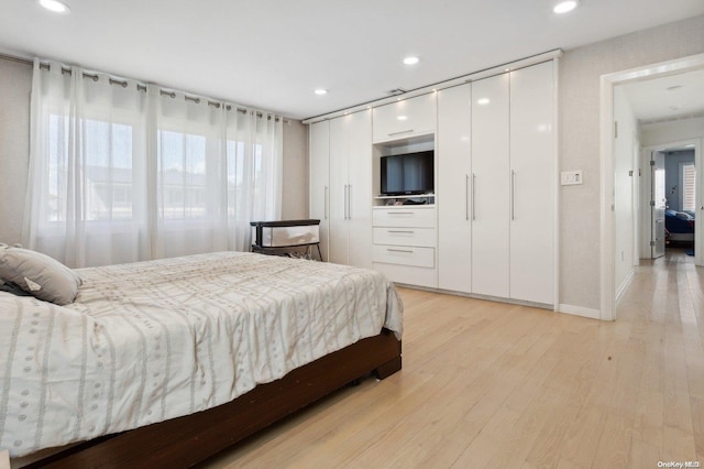 bedroom with light wood-type flooring