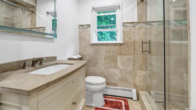 bathroom with vanity, a baseboard heating unit, a shower with door, and toilet