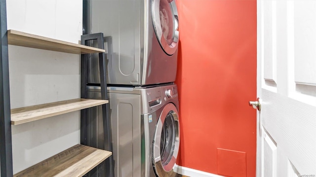 washroom with stacked washer and dryer