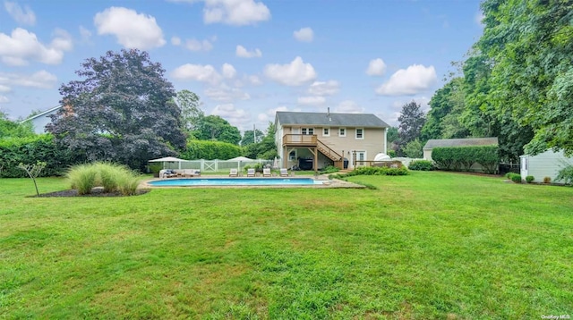 exterior space featuring a yard and a swimming pool side deck