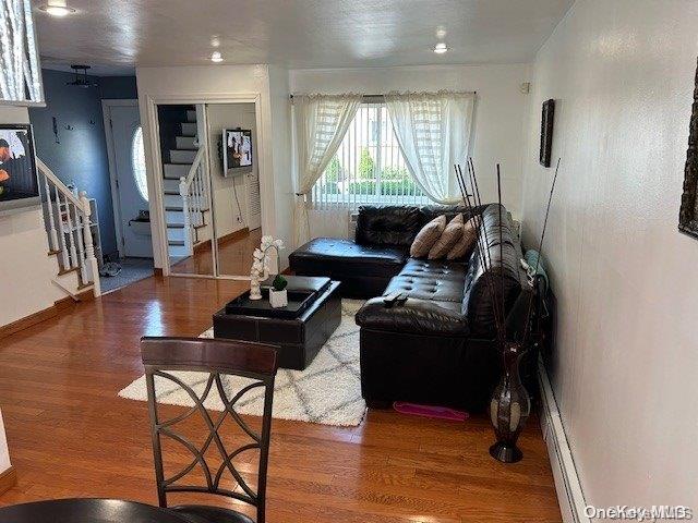 920 Broadway Unit 15, Woodmere, NY 11598 - living room featuring stairway and wood finished floors