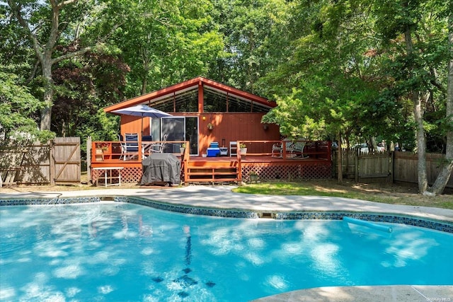 view of swimming pool with a wooden deck