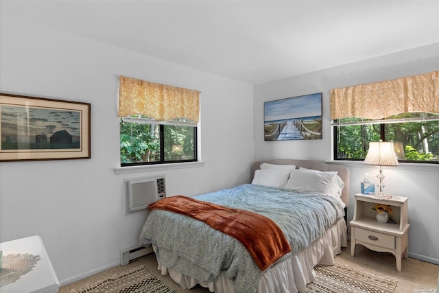 bedroom with an AC wall unit, multiple windows, carpet, and a baseboard heating unit