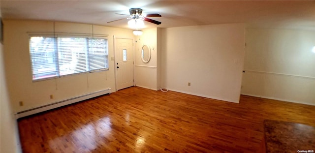 unfurnished room featuring a baseboard radiator, hardwood / wood-style flooring, and ceiling fan