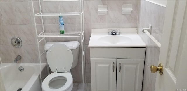 full bathroom with bathing tub / shower combination, vanity, tile walls, and toilet