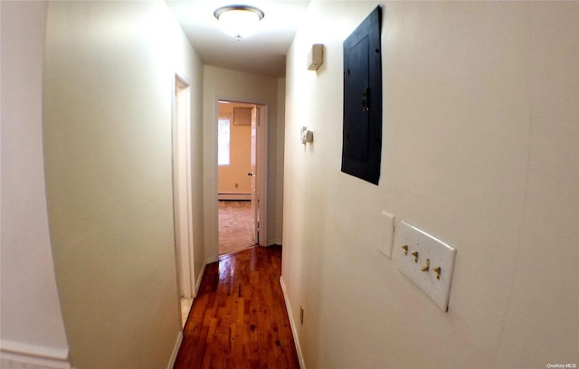 hallway with electric panel, dark hardwood / wood-style floors, and a baseboard heating unit