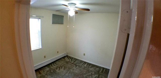 carpeted empty room with ceiling fan and a baseboard radiator