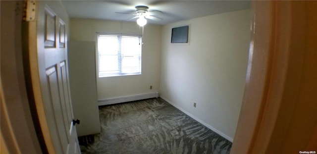 empty room featuring ceiling fan and a baseboard radiator