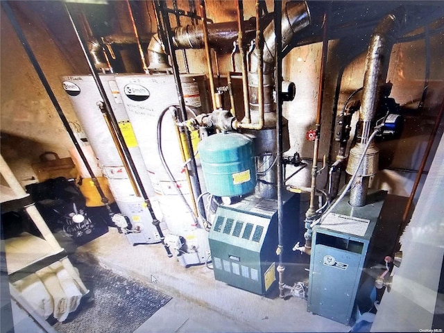 utility room featuring gas water heater