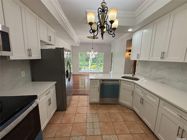 kitchen with black appliances, white cabinetry, light tile patterned floors, and a chandelier