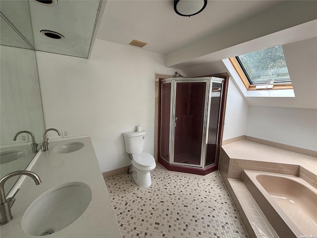 full bathroom featuring vanity, tile patterned floors, a skylight, toilet, and shower with separate bathtub