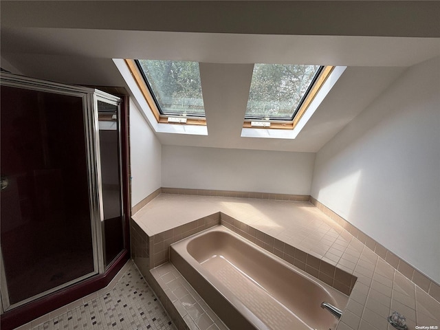 bathroom featuring tile patterned flooring and independent shower and bath