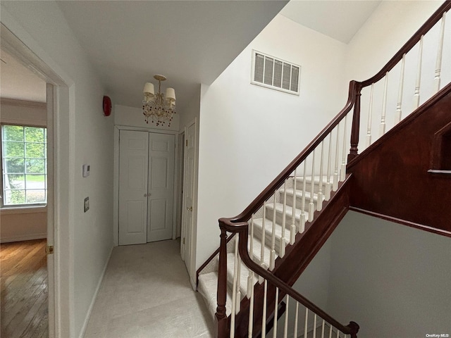 interior space featuring light hardwood / wood-style floors and an inviting chandelier