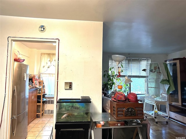 kitchen featuring stainless steel fridge and parquet floors