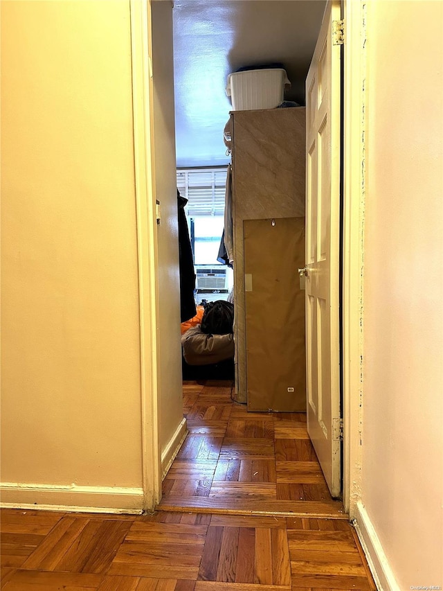 hallway with dark parquet flooring