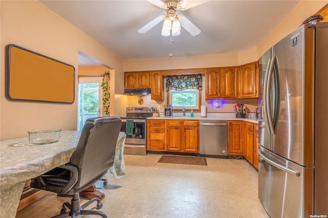 kitchen with stainless steel appliances, ceiling fan, and sink