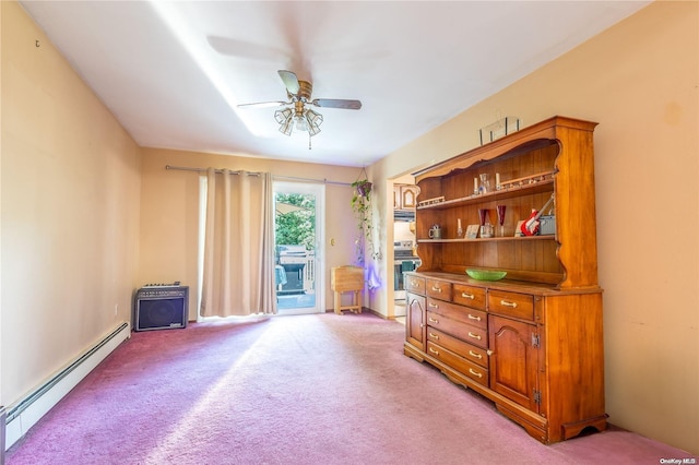 misc room featuring ceiling fan, light colored carpet, and a baseboard radiator