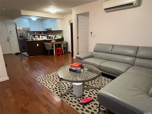 living room with dark hardwood / wood-style floors and a wall mounted AC