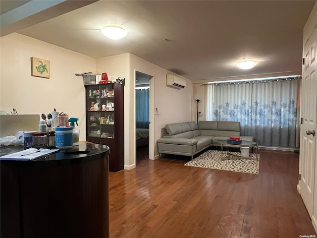 living room featuring an AC wall unit and dark wood-type flooring