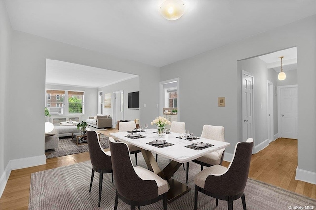 dining area with light hardwood / wood-style floors