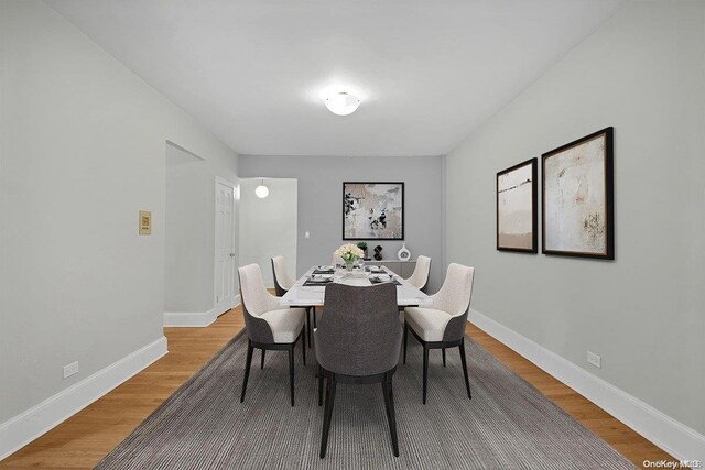 dining room with wood-type flooring