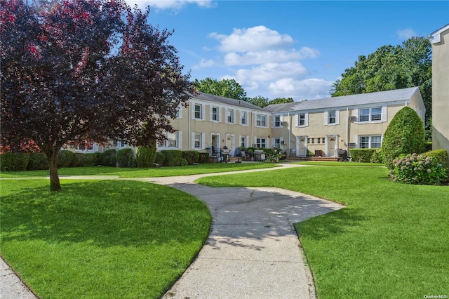 view of front of home with a front lawn