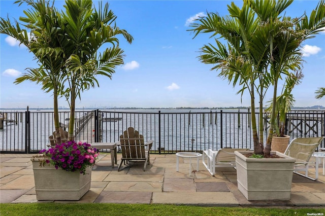 view of patio with a water view