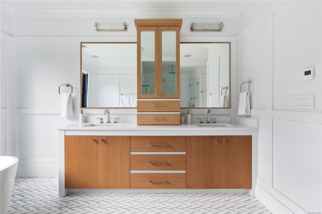 bathroom featuring a tub, crown molding, and vanity