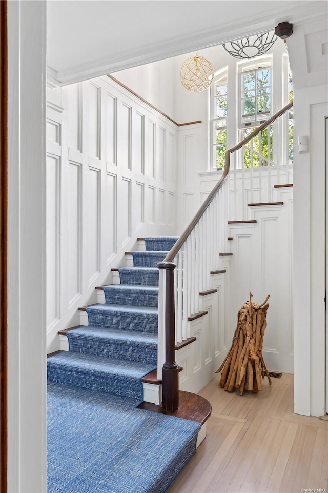 staircase featuring hardwood / wood-style floors